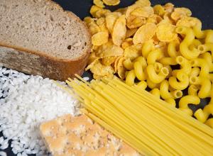 a close up of food: Carbs have had a bad rap among dieters ever since low-carb diets, like Atkins, rose in popularity in the early 2000s. Before then, simple carbs formed the base of the now-outdated food pyramid. At the time, diet experts recommended that bread, cereal, rice, and pasta should make up most of your diet, accounting for six to 11 servings per day—which exceeds the recommended servings of the fruit and vegetable groups combined.Even though they're delicious, carb-heavy favorites like bread, pasta, cereal, and rice are often blamed for our collectively rising rates of heart disease, obesity, and insulin resistance.Not all carbs are a dietary evil, though, and not eating enough carbs can lead to unpleasant symptoms like headaches, GI irregularity, and fatigue. On the flip side, the fact that your body needs some carbs to function doesn't mean you can go carb-crazy all day, every day."The Dietary Guidelines for Americans recommend that carbohydrates make up 45 to 65% of your total daily calories," says New Jersey-based registered dietitian and certified diabetes expert Erin Palinski-Wade, RD, CDE author of Belly Fat Diet For Dummies. "Based on a 2,000 calorie diet, that's 225 to 325 grams of carbohydrates per day."Palinski-Wade adds that your personal carbohydrate needs depend on your age, activity level, and individual metabolism. But regardless of exactly how many carbs is right for you, the type of carbs to eat is the same for everyone.Everyone should aim to consume healthy carbs: slow-digesting carbs like 100% whole wheat bread, steel-cut oats, beans, lentils, and whole fruits and vegetables. And you should avoid fast-digesting carbs such as sugary cereal, white bread, white rice, and processed snacks."It's best to get your carbohydrates from whole foods, rather than from added sugar such as cane sugar," says Amy Gorin, MS, RDN, a registered dietitian in the New York City area. "Calories from added sugar should be capped at 10% of your total daily calories."Since finding the right ratio is tricky, how can you tell if your carb balance is out of whack? Here are 8 warning signs to look for that indicate you've been eating too many simple carbs. As for the reason you're eating more carbs than you should be? Look to these 21 Hidden Sources of Carbs You Won't Believe.