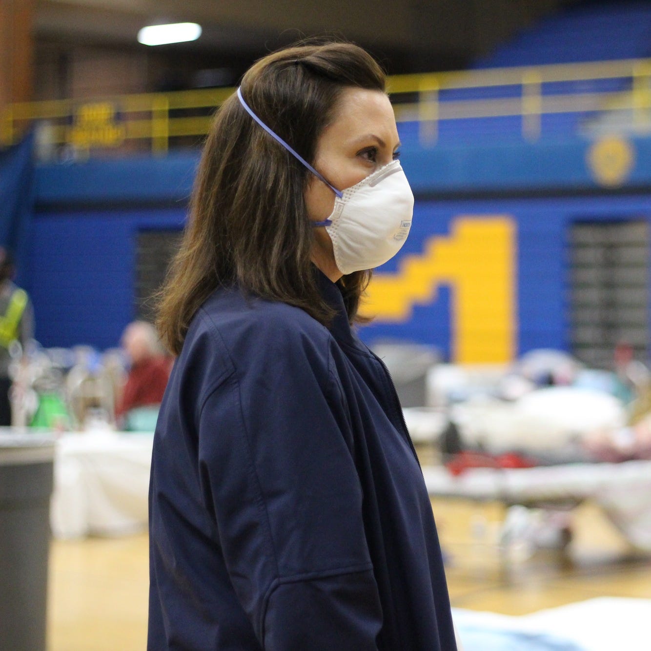 Michigan Governor Gretchen Whitmer visits an emergency shelter for flood evacuees at Midland High School Wednesday. 